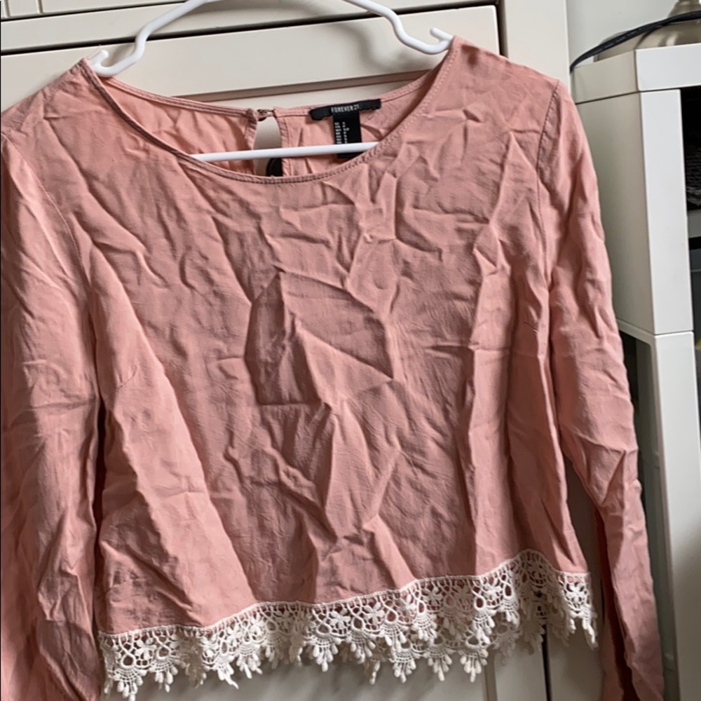 Pink/ salmon colored blouse. White lace detailing